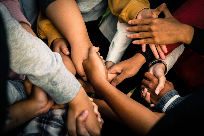 Hands joined together — caring for every member of the community